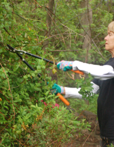 Woman trims overgrowth